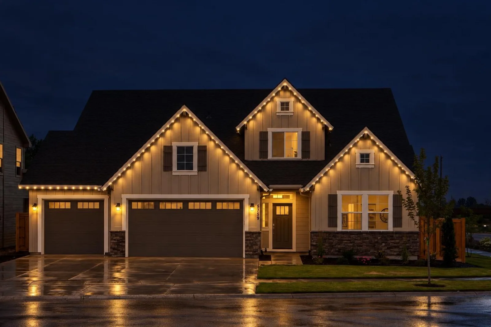 Render of a house with three gables and warm white permanent lights at night